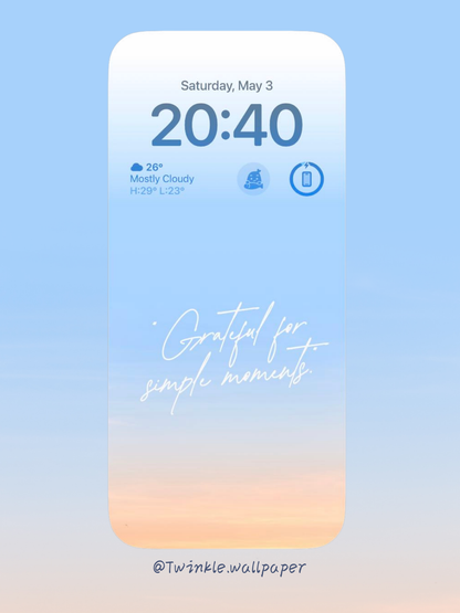 A calming pastel wallpaper with a gradient of soft blue and warm peach, featuring the text "Grateful for Simple Moments." This minimalist design enhances any device with a serene and inspirational touch.